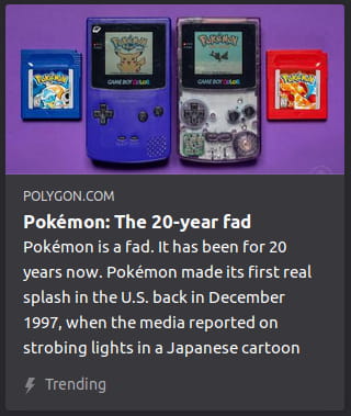 By Polygon. Photo o’ 2 Game Boy Colors side-by-side in the center, 1 playing Pokémon Yellow, the other playing Pokémon Gold. On either side o’ them are cartridges for Pokémon Blue & Red.