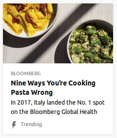By Bloomberg. Photo o’ 2 bowls o’ pasta on either edge, divided by a long shadow.